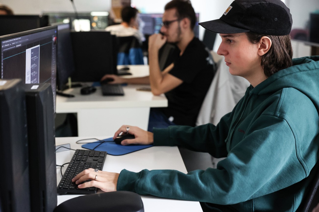 ESMA 3D student working on computer in computer room