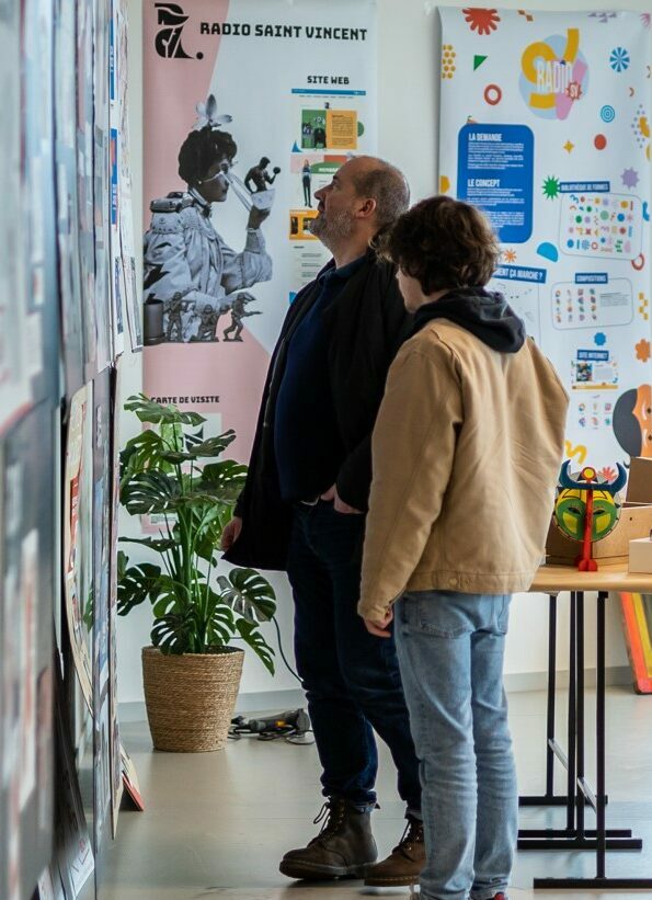Visitors discovering student projects exhibited during ESMA Rennes' Open Days